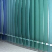 a row of floor-length aqua vertical blinds