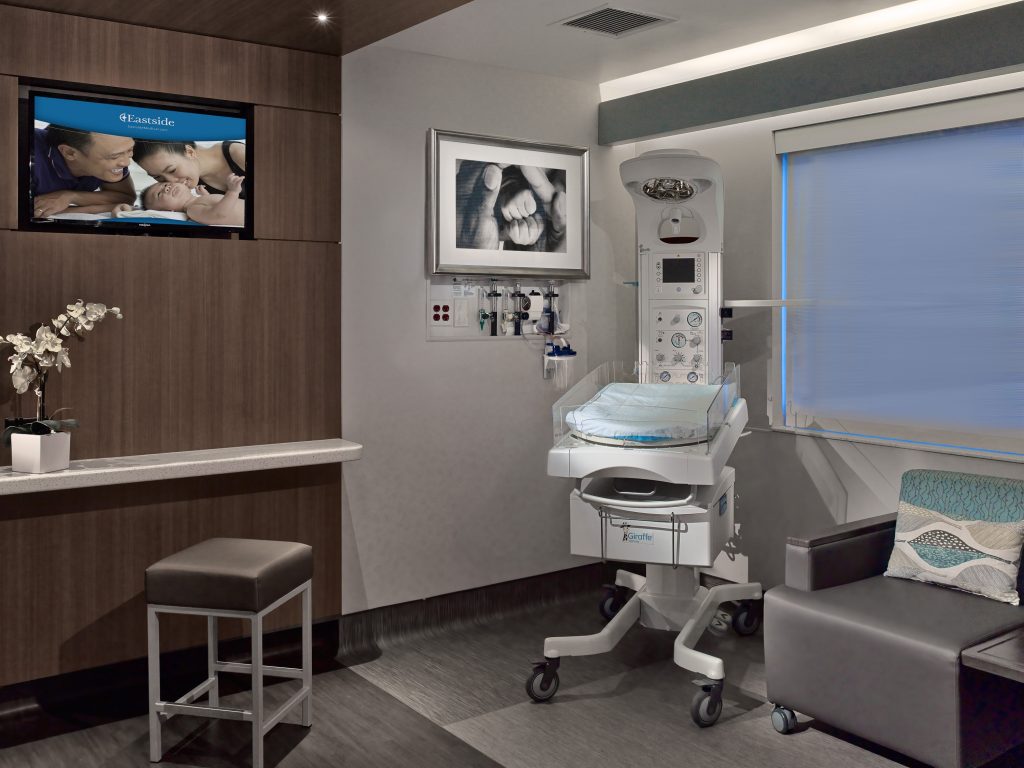 Eastside Women's care room with modern seating, countertop, and machinery