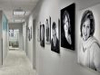 Black and white accent portrait wall in Robinson Facial Plastic Surgery center