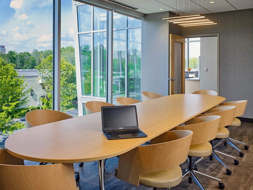 Polaris Spine and Neurosurgery conference room with a long table and glass window wall