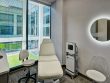 Dermatology Consultants patient room with modern seating and full window wall