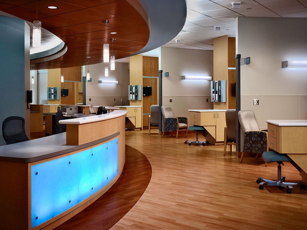 Full view of nurse area in Kirkland Cancer Center with stunning glowing accent fixture on counters