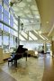 lobby of Slidell Memorial Hospital with a high ceiling, glass window wall, and piano near the entrance