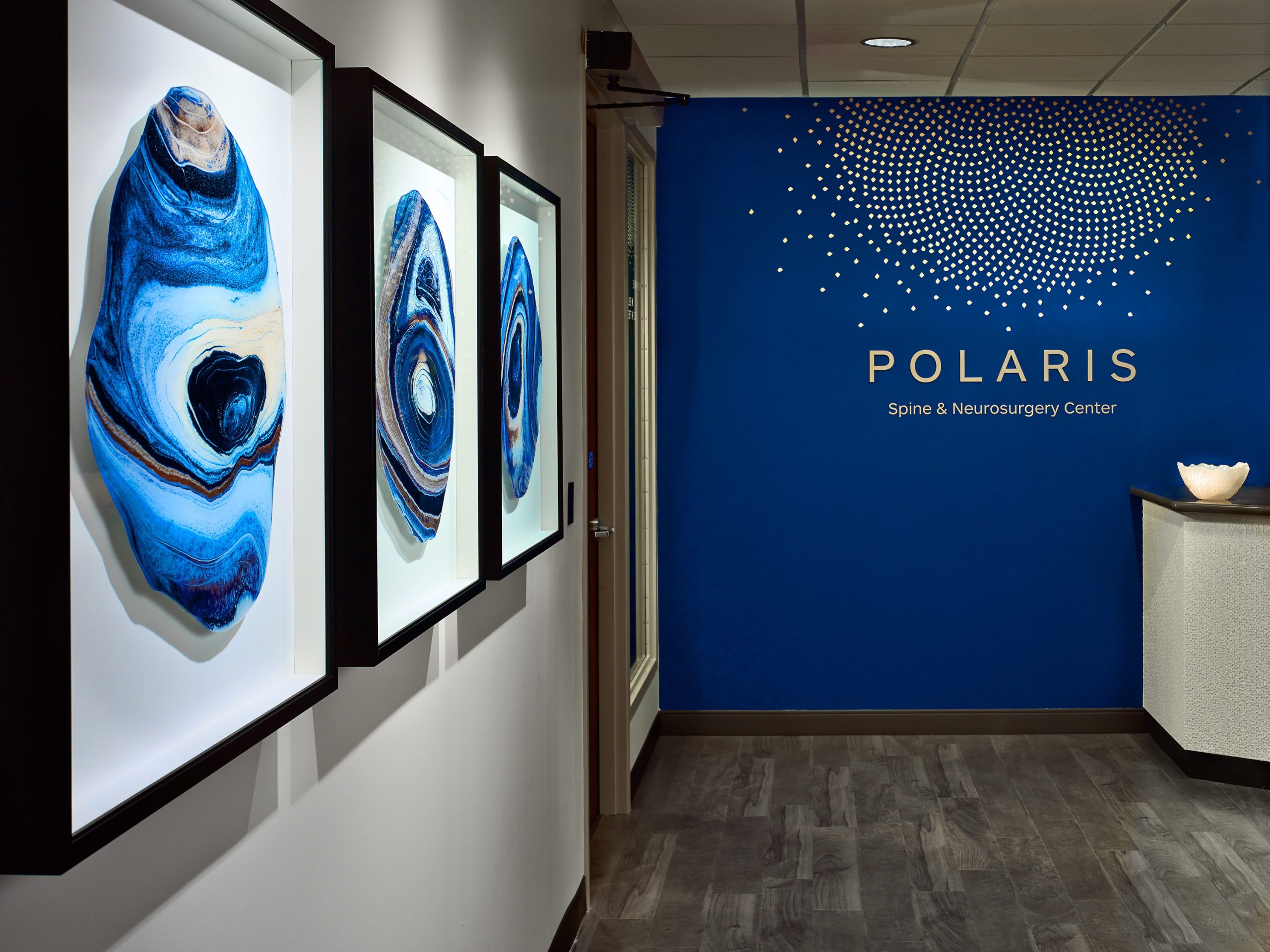hallway leading to Polaris Spine and Neurosurgery center with blue agate wall art