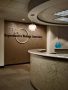reception area for Reproductive Biology Associates with a rounded counter and logo wall