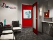 reception area for Vein Atlanta with red accent walls and doorframes