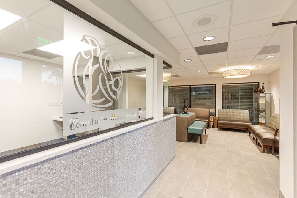 Comprehensive Women's OBGYN reception area with beautiful seaglass counter