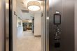 Elevator view of Comprehensive Women's OBGYN reception area with stunning chandelier