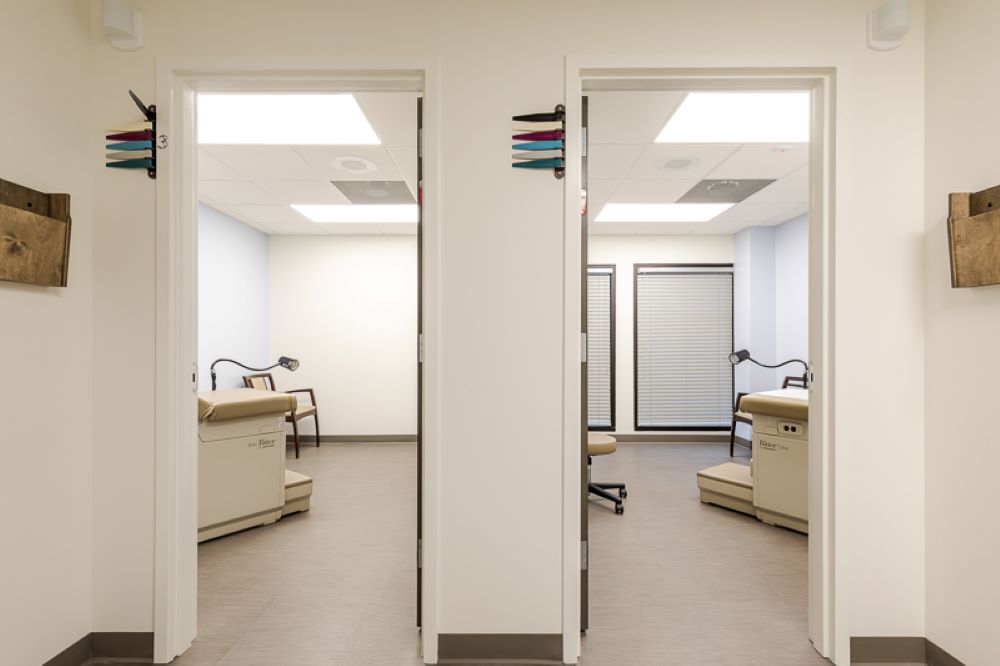 Doorway view of two patient rooms in Comprehensive Women's OBGYN